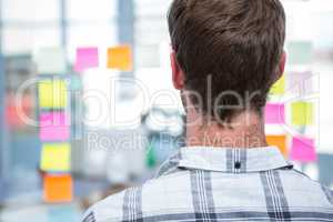 Hipster man in front of post-it