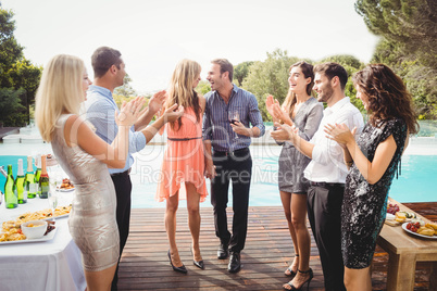 Happy young friends having drinks