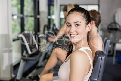 Fit woman doing exercise bike