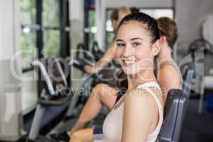 Fit woman doing exercise bike