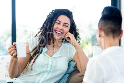 Lesbian couple having a cup of coffee