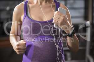 Pregnant woman exercising on a treadmill