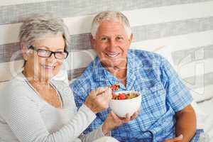 Happy senior couple in bedroom