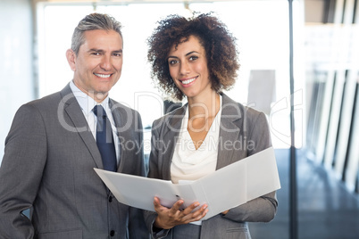 Businessman and colleague with documents