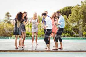 Happy young friends having drinks