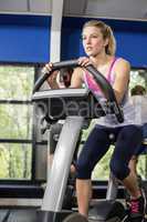 Fit woman doing exercise bike