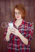beautiful hipster woman concentrating on her smartphone