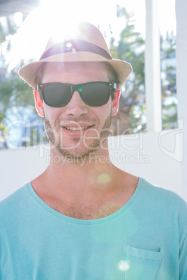 Hipster man posing with sunglasses