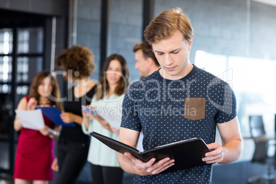 Man reading a document in office