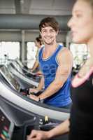 Athletic man running on treadmill