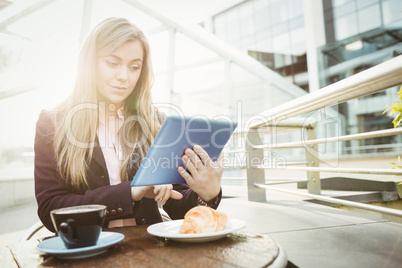 Businesswoman using her tablet pc