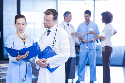 Doctors looking at medical report