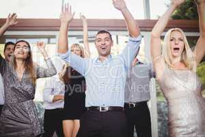 Group of young friends dancing