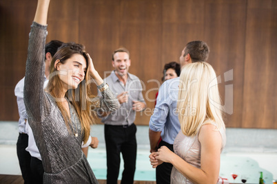 Group of young friends dancing