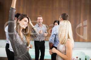 Group of young friends dancing