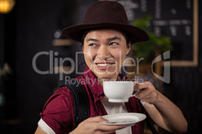 Happy customer drinking coffee