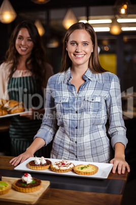 Smiling woman standing in the bar