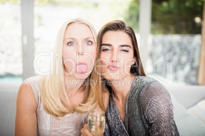 Beautiful women making funny faces