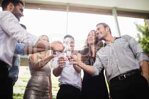 Group of friends toasting glasses of champagne