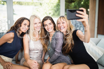 Beautiful women taking selfie with mobile phone