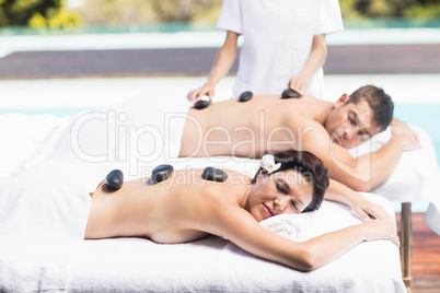 Couple getting a hot stone massage