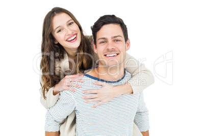 Man giving piggy back to his girlfriend