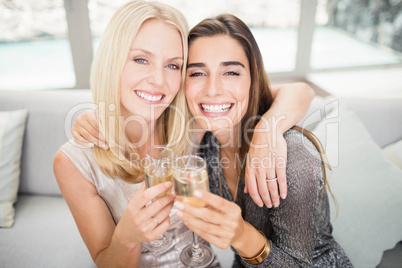 Portrait of beautiful women having champagne flute