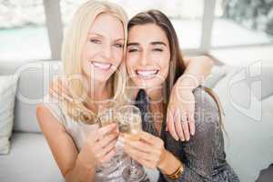 Portrait of beautiful women having champagne flute