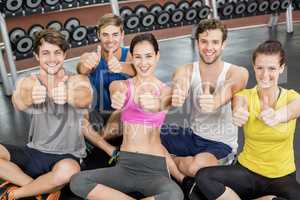 Fitness class showing thumbs up