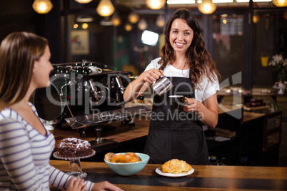 Pretty barista making cappuccino