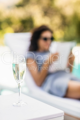 Close-up of champagne flute on side table