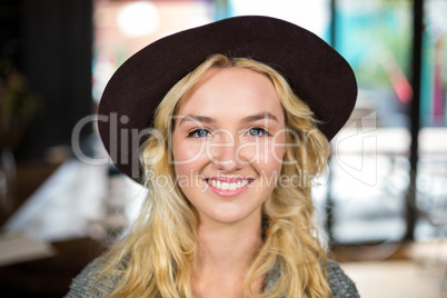 Smiling blonde with a hat