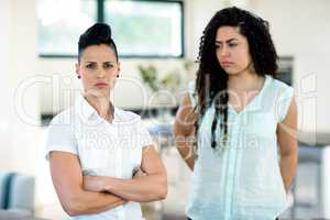 Unhappy lesbian couple ignoring each other