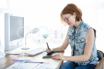 hipster businesswoman drawing on her tablet