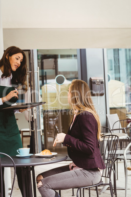 Woman talking with waitress