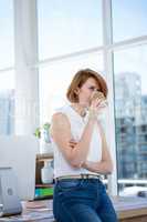 hipster business woman drinking a cup of coffee