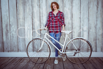 beautiful hipster woman with a bicycle