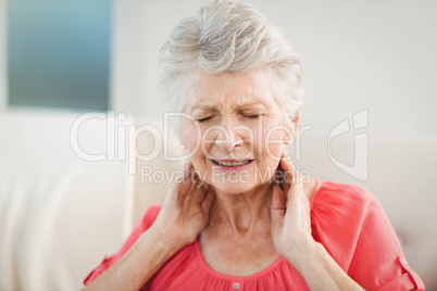 Senior woman suffering from neck pain