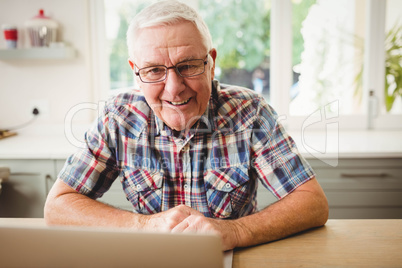 Senior man using laptop