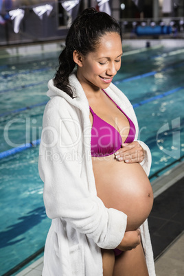 Pregnant woman touching her belly