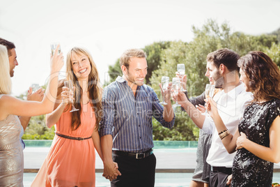 Happy young friends having drinks