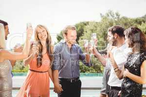 Happy young friends having drinks