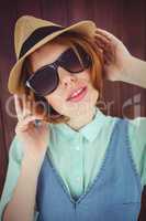 Cute red haired hipster with sunglasses