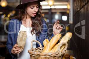 Smiling woman looking at bread