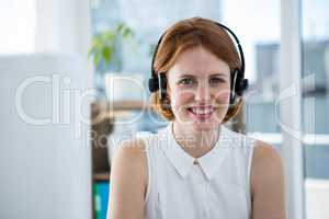 smiling hipster business womann wearing headphones
