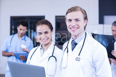 Portrait of doctors using laptop