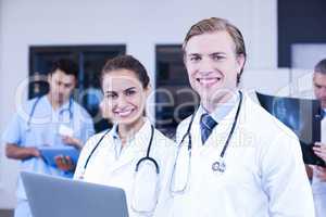 Portrait of doctors using laptop