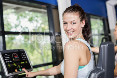 Fit woman doing exercise bike