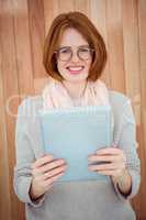 Red haired hipster using tablet