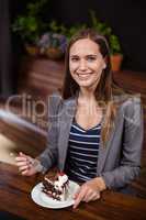 Woman about to eat a piece of cake